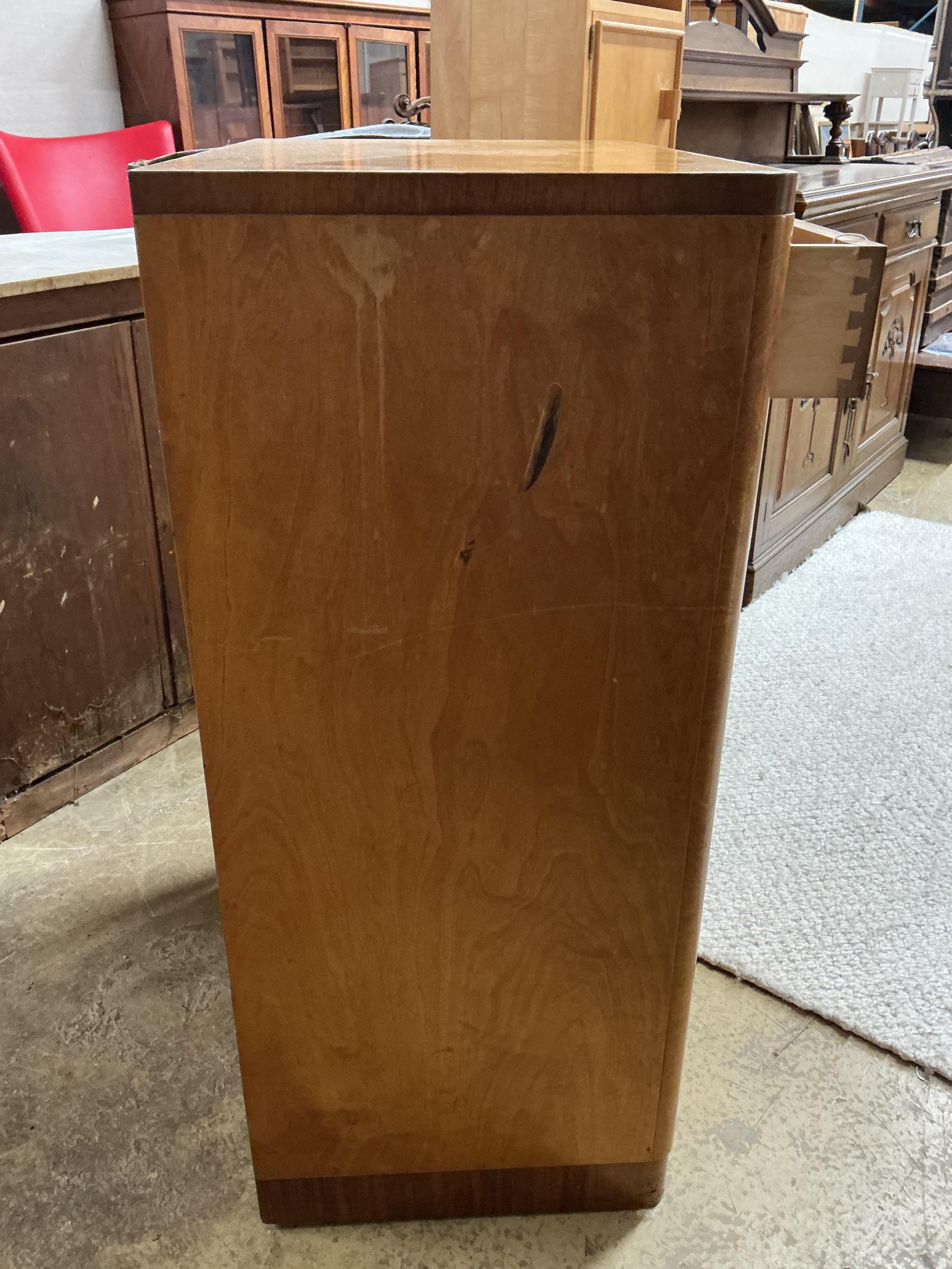 An early 20th century maple two drawer press cupboard, width 68cm, depth 45cm, height 107cm